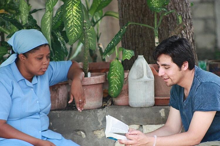 Juan, CARITAS For Children's Program Administrator, and a Little Sister share stories.