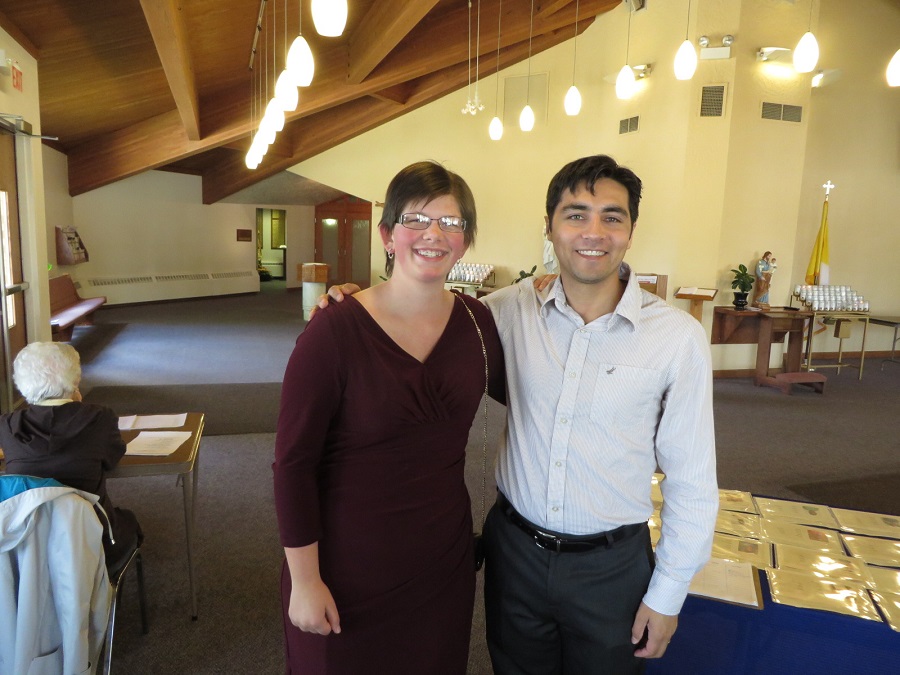 Madeleine helping out Program Administrator, Juan Urrea at a Parish Weekend CARITAS For Children presentation
