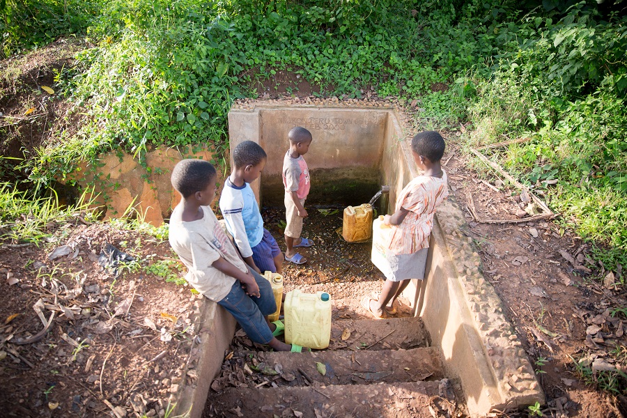 Filling jerry cans from a water pipe