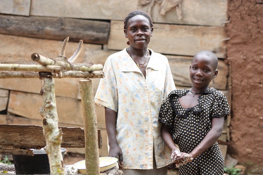 Cleire and her aunt in front of their home