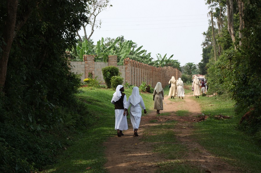 After the funeral, sisters walk home to resume their service in God's name