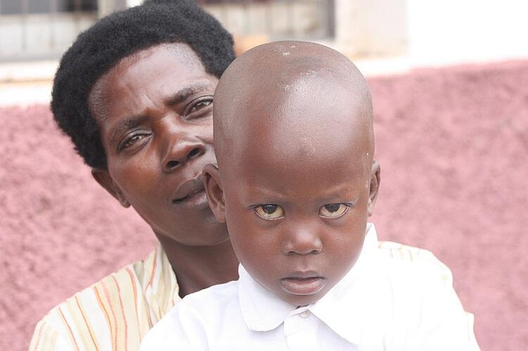 Grandma Nakitanda holds her grandson Ron